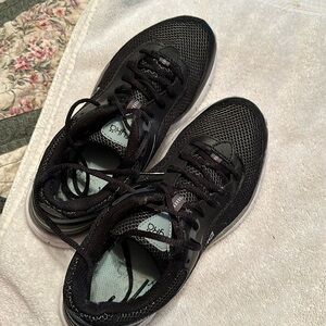 Women’s Ryka size 7.5. Black and Gray. In good shape. Dog and car friendly home.